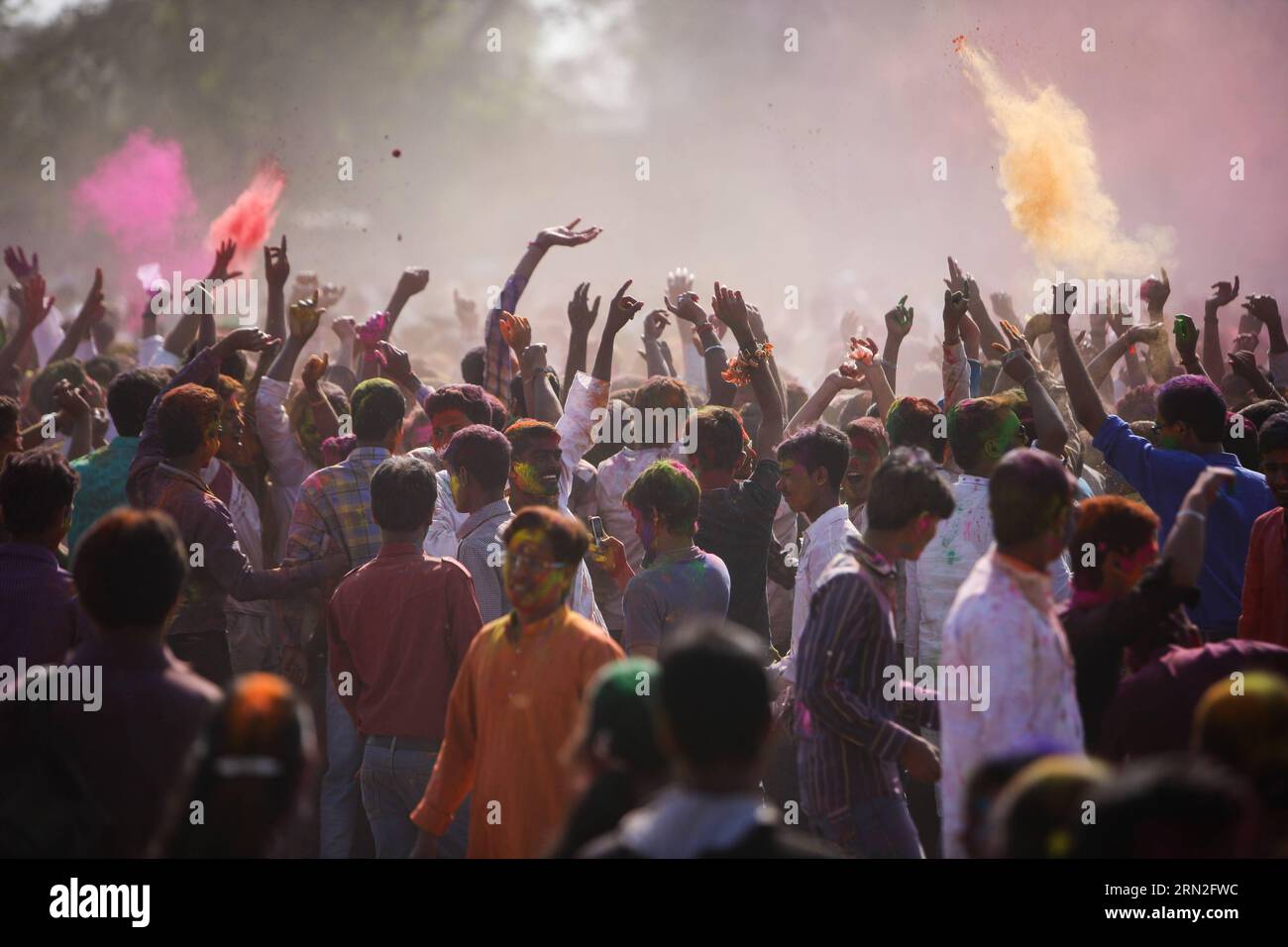 (150305) -- SANTINIKETAN, March 5, 2015 -- People throw colored powders as they dance to celebrate the holi festival in Santiniketan, a small town near Bolpur in the Birbhum district of West Bengal, India, on March 5, 2015. Holi , the festival of colors, is a popular celebration of the coming of spring and it falls in West Bengal of India on the day of full moon annually in March. People play with colored powder on each other with great joy. ) INDIA-WEST BENGAL-HOLI ZhengxHuansong PUBLICATIONxNOTxINxCHN   March 5 2015 Celebrities Throw Colored Powders As They Dance to Celebrate The Holi Festiv Stock Photo