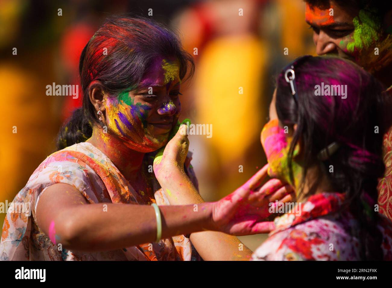 (150305) -- SANTINIKETAN, March 5, 2015 -- People smear each other with colored powders to celebrate the holi festival in Santiniketan, a small town near Bolpur in the Birbhum district of West Bengal, India, on March 5, 2015. Holi , the festival of colors, is a popular celebration of the coming of spring and it falls in West Bengal of India on the day of full moon annually in March. People play with colored powder on each other with great joy. ) INDIA-WEST BENGAL-HOLI ZhengxHuansong PUBLICATIONxNOTxINxCHN   March 5 2015 Celebrities smear each Other With Colored Powders to Celebrate The Holi Fe Stock Photo