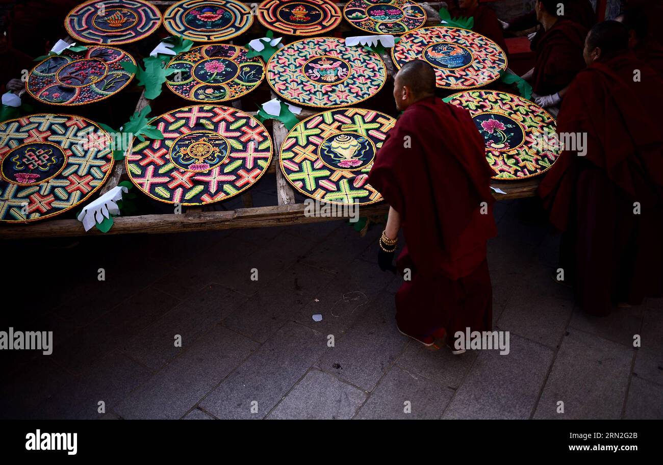 (150305) -- XINING, March 5, 2015 -- Monks looks at ghee flower artworks at Taer Monastery in Xining, northwest China s Qinghai Province, March 5, 2015. Ghee flower exhibitions are held in Taer Monastery in Qinghai Province and Labrang Monastery in Gansu Province, both presitigious Tibetan Buddhist monasteries, to celebrate the Lantern Festival on March 5. ) (zkr) CHINA-QINGHAI-GANSU-GHEE FLOWER-EXHIBITIONS (CN) ZhangxHongxiang PUBLICATIONxNOTxINxCHN   Xining March 5 2015 Monks Looks AT Ghee Flower Artworks AT Taer monastery in Xining Northwest China S Qinghai Province March 5 2015 Ghee Flower Stock Photo