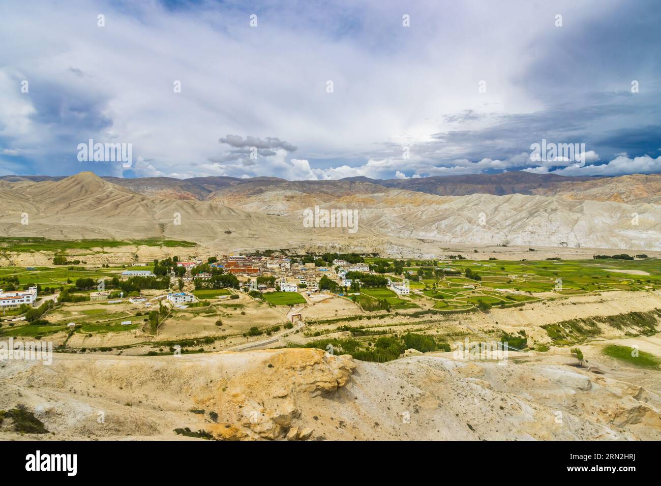 Landscape view of Kingdom of Lo Manthang with Green Tibetan Desert Background in Mustang of Nepal Stock Photo