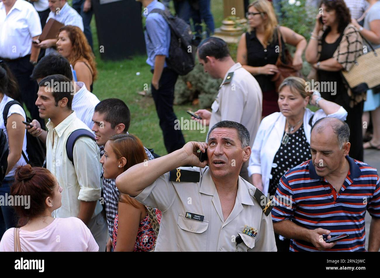 (150311) -- BUENOS AIRES, March 11, 2015 -- Residents gather during evacuation due to a fire in Buenos Aires, Argentina, on March 11, 2015. The fire was caused by a short circuit in the electrical panel of one of the elevators in the building, so that all staff was evacuated, and so far no casualties were reported, according with local press information. Victoria Egurza/TELAM) (jg) ARGENTINA-BUENOS AIRES-ACCIDENT-FIRE e TELAM PUBLICATIONxNOTxINxCHN Buenos Aires March 11 2015 Residents gather during Evacuation Due to a Fire in Buenos Aires Argentina ON March 11 2015 The Fire what CAUSED by a Stock Photo