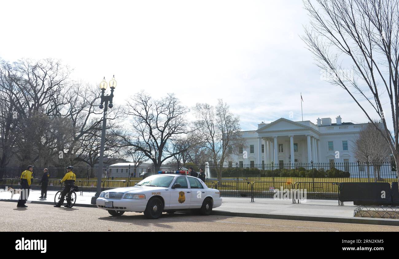 (150313) -- WASHINGTON D.C., March 13, 2015 -- Secret service agents guard the White House in Washington D.C., capital of the United States, March 13, 2015. For a U.S. federal agency with a name that suggests secrecy, putting itself repeatedly in the limelight for negative news coverage is quite a bitter irony. The Secret Service, widely perceived as the most elite law enforcement team in the United States that protects the U.S. president and the First Family, landed itself in hot water again after U.S. media revealed earlier this week that two top Secret Service barreled through a scene of an Stock Photo