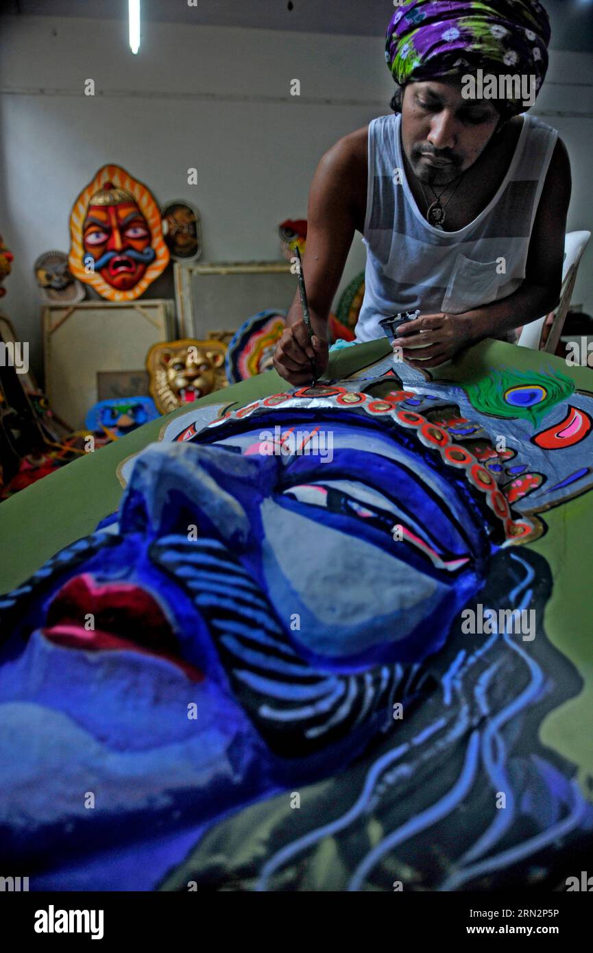 Finishing touches are being given to masks at the Institute of Fine Arts of Dhaka University, Bangladesh, 13 April, 2023. The masks are for Mangal Sho Stock Photo