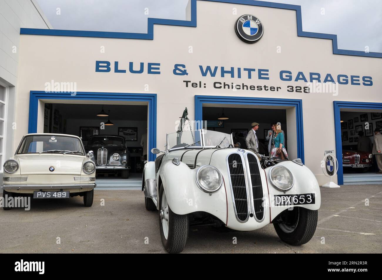 Reproduction of a BMW garage showroom, named Blue & White Garages of Chichester, at the Goodwood Revival old times event. Frazer Nash 328 / BMW 328 Stock Photo