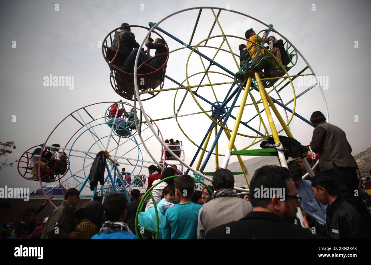 (150321) -- KABUL, March 21, 2015 -- Afghan children enjoy the sky wheel during a celebration of Nowruz festival in Kabul, Afghanistan, March 21, 2015. Afghans celebrate the Nowruz festival as the first day of the year in Persian calendar. ) AFGHANISTAN-KABUL-NOWRUZ FESTIVAL AhmadxMassoud PUBLICATIONxNOTxINxCHN   Kabul March 21 2015 Afghan Children Enjoy The Sky Wheel during a Celebration of Nowruz Festival in Kabul Afghanistan March 21 2015 Afghans Celebrate The Nowruz Festival As The First Day of The Year in Persian Calendar Afghanistan Kabul Nowruz Festival  PUBLICATIONxNOTxINxCHN Stock Photo