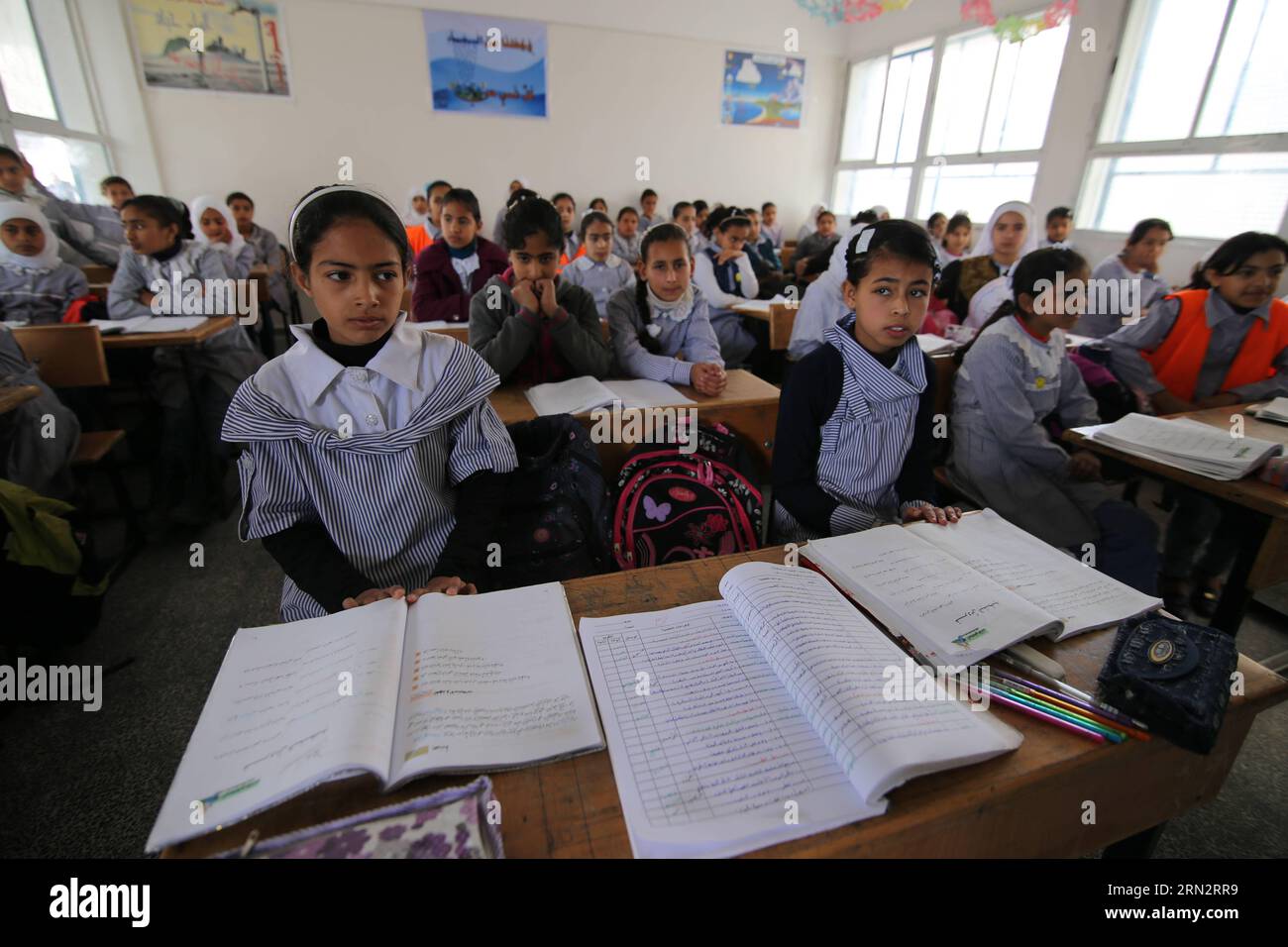 (150322) -- GAZA, March 22, 2015 -- Palestinian students attend a lesson at a UN-run school which is reopened after it was damaged during the war between Israel and Hamas militants in Khuzaa village of the southern Gaza Strip city of Khan Yunis, on March 22, 2015. ) MIDEAST-GAZA-REOPEN-SCHOOL KhaledxOmar PUBLICATIONxNOTxINxCHN   Gaza March 22 2015 PALESTINIAN Students attend a Lesson AT a UN Run School Which IS reopened After IT what damaged during The was between Israel and Hamas militant in  Village of The Southern Gaza Strip City of Khan Yunis ON March 22 2015 Mideast Gaza reopen School  PU Stock Photo