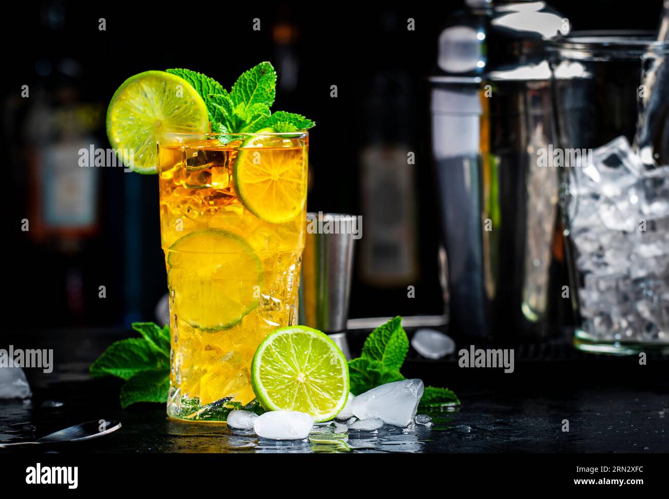 Dark and Stormy cocktail drink with dark rum, ginger ale, lime and ice