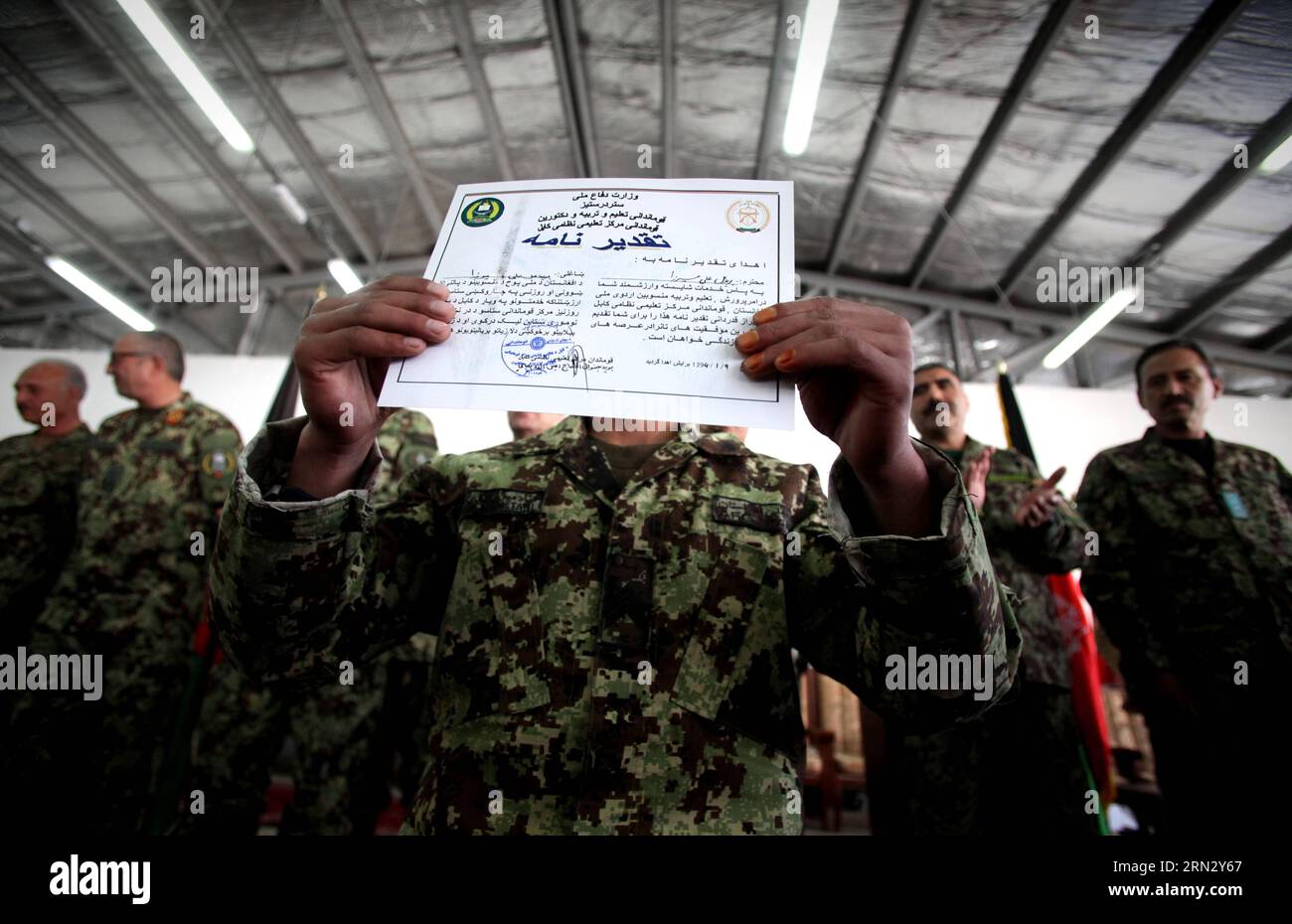 (150329) -- KABUL, March 29, 2015 -- An Afghan new national army soldier shows his certificate during a graduation ceremony at an army training center in Kabul, Afghanistan, March 29, 2015. Around 2,400 soldiers of Afghan national army graduated after four months training in Kabul. ) AFGHANISTAN-KABUL-ARMY AhmadxMassoud PUBLICATIONxNOTxINxCHN   Kabul March 29 2015 to Afghan New National Army Soldier Shows His Certificate during a Graduation Ceremony AT to Army Training Center in Kabul Afghanistan March 29 2015 Around 2 400 Soldiers of Afghan National Army graduated After Four MONTHS Training i Stock Photo