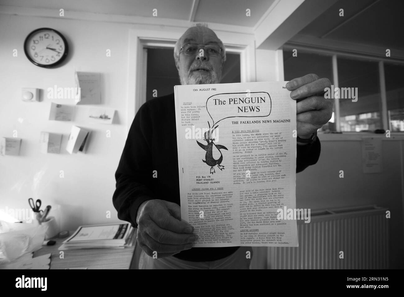 (150402) -- PUERTO ARGENTINO, Apr. 2, 2015 -- Image taken on Apr. 4, 2012, shows John Fowler, the sub-editor of the only local newspaper Penguin News, showing a publication of 1982 after the war in Puerto Argentino, Falkland Islands. Argentine Foreign Minister Hector Timerman on March 30, 2015 wrote to international organizations to denounce Britain for boosting military presence in the Malvinas Islands, known as the Falklands in the European country. Britain and Argentina went to war over the islands in 1982, after Argentina ventured to reclaim the territory by sending a naval force. Britain Stock Photo
