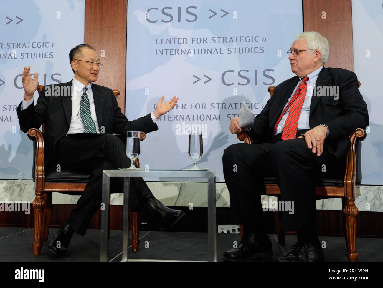 (150407) -- WASHINGTON D.C., April 7, 2015 -- World Bank President Jim Yong Kim (L) gives a public address at the Center for Strategic and International Studies (CSIS) in Washington D.C., capital of the United States, April 7, 2015. World Bank welcomes the new development banks, such as China-proposed Asian Infrastructure Investment Bank (AIIB) and the New Development Bank established by the BRICS countries, and is ready to share experience with them, World Bank President Jim Yong Kim said on Tuesday. ) U.S.-WASHINGTON D.C.-CSIS-WORLD BANK-PRESIDENT BaoxDandan PUBLICATIONxNOTxINxCHN   Washingt Stock Photo
