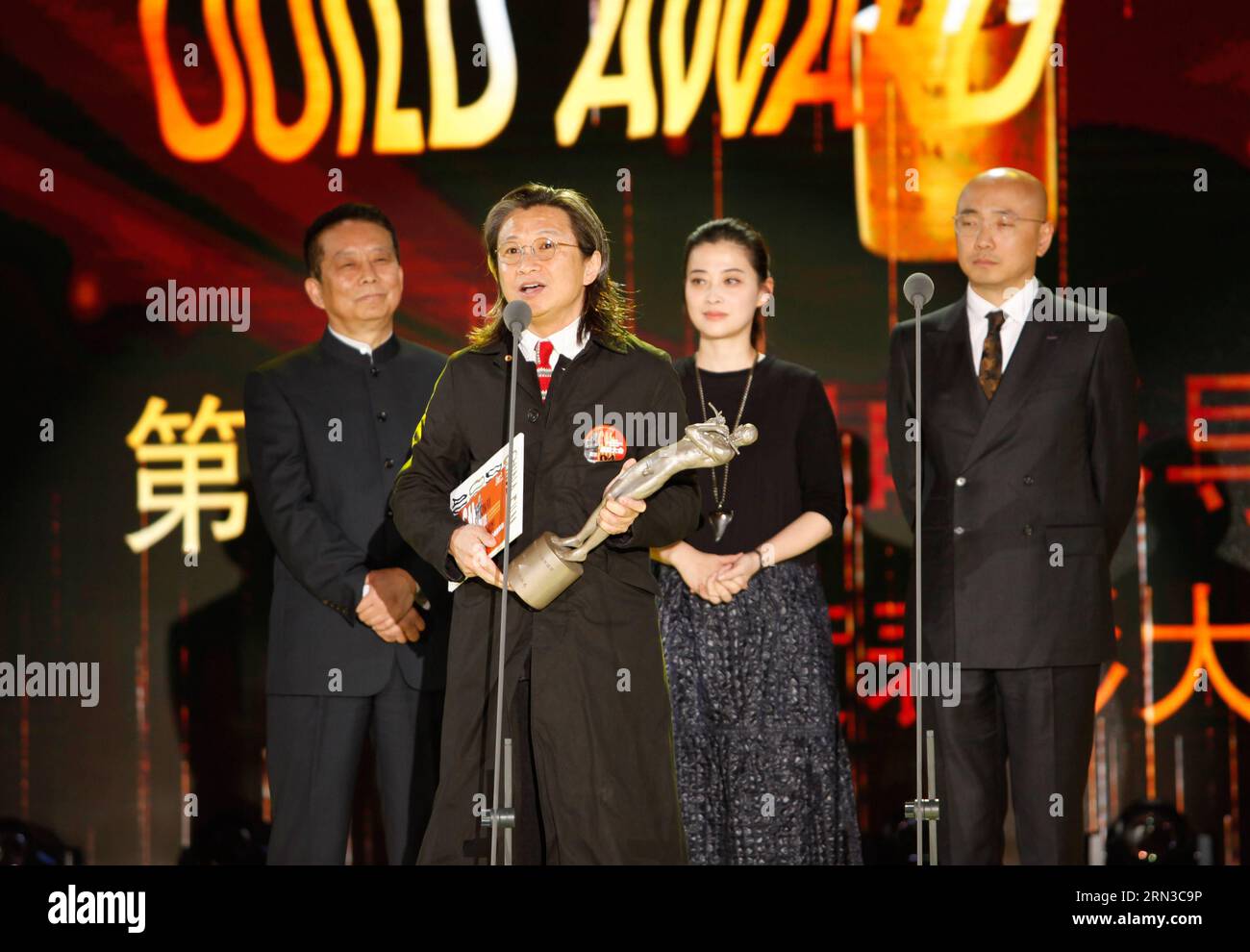 Director Peter Chan (2nd L), winner of the Annual Special Honour Movie Award for his movie Dearest , speaks at the 2014 annual awarding conference of China Film Directors Guild in Beijing, capital of China, April 12, 2015. ) (ytt) CHINA-BEIJING-FILM DIRECTORS GUILD(CN) JinxLiangkuai PUBLICATIONxNOTxINxCHN   Director Peter Chan 2nd l Winner of The Annual Special Honour Movie Award for His Movie Dearest Speaks AT The 2014 Annual awarding Conference of China Film Directors Guild in Beijing Capital of China April 12 2015  China Beijing Film Directors Guild CN JinxLiangkuai PUBLICATIONxNOTxINxCHN Stock Photo