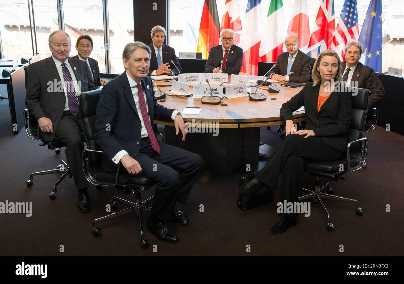 (150415) -- LUEBECK, April 15, 2015 -- (L to R)Canadian Foreign Minister Robert Nicholson, Japanese Foreign Minister Fumio Kishida, British Foreign Secretary Philip Hammond, US Secretary of State John Kerry, German Foreign Minister Frank-Walter Steinmeier, French Foreign Minister Laurent Fabius, EU Foreign Policy Chief Federica Mogherini and Italian Foreign Minister Paolo Gentiloni pose for photos during a plenary session of the meeting of the G7 Foreign Ministers in Luebeck, Germany, on April. 15, 2015. The G7 foreign ministers issued here a joint statement on Wednesday, urging all sides to i Stock Photo