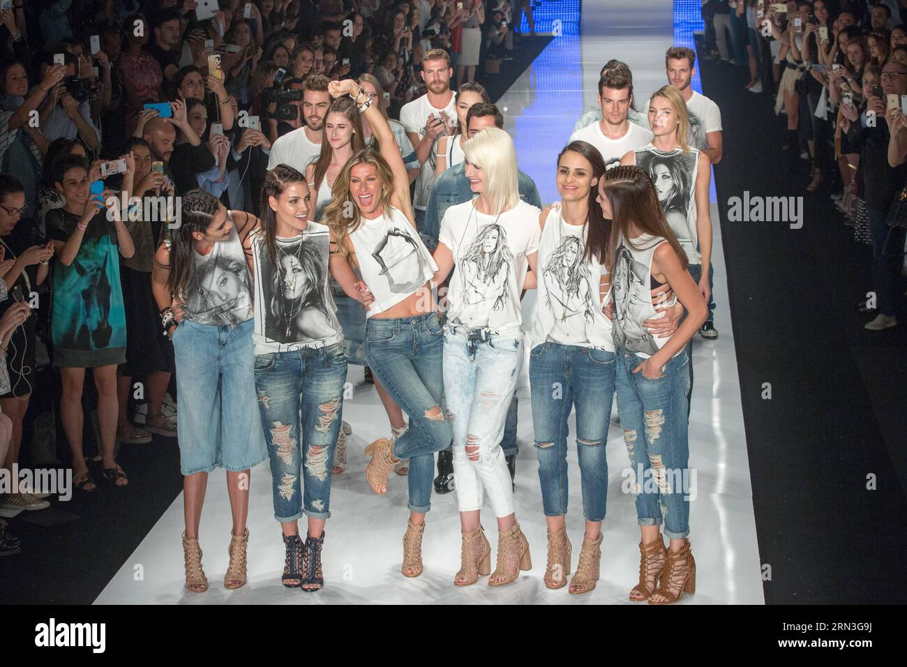 SAO PAULO, April 15, 2015 -- Brazilian supermodel Gisele Bundchen (3rd L, front) reacts with other models during a fashion show of Colcci on Sao Paulo Fashion Week in Sao Paulo, Brazil, April 15, 2015. Gisele Bundchen made her last catwalk stroll down Wednesday night, putting an farewell to her 20-year career which has made her a legend in fashion industry. The 34-year-old Brazilian woman is currently the world s highest-paid model according to a Forbes magazine ranking in 2014. ) (bxq) BRAZIL-SAO PAULO-GISELE BUNDCHEN RETIRES XuxZijian PUBLICATIONxNOTxINxCHN   Sao Paulo April 15 2015 Brazilia Stock Photo