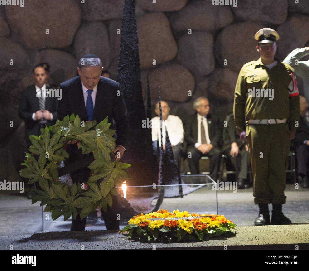 (150416) -- JERUSALEM, April 16, 2015 -- Israeli Prime Minister Benjamin Netanyahu (front) lays a wreath for holocaust victims during the Holocaust Remembrance Day at the Yad Vashem Holocaust Memorial Museum in Jerusalem, on April 16, 2015. From Wednesday sunset to Thursday, Israel officially commemorated the genocide of six million Jews by Nazi Germany during the World War II. GPO/) (djj) MIDEAST-JERUSALEM-HOLOCAUST REMEMBRANCE DAY AmosxBenxGershom PUBLICATIONxNOTxINxCHN   Jerusalem April 16 2015 Israeli Prime Ministers Benjamin Netanyahu Front Lays a  for Holocaust Victims during The Holocau Stock Photo