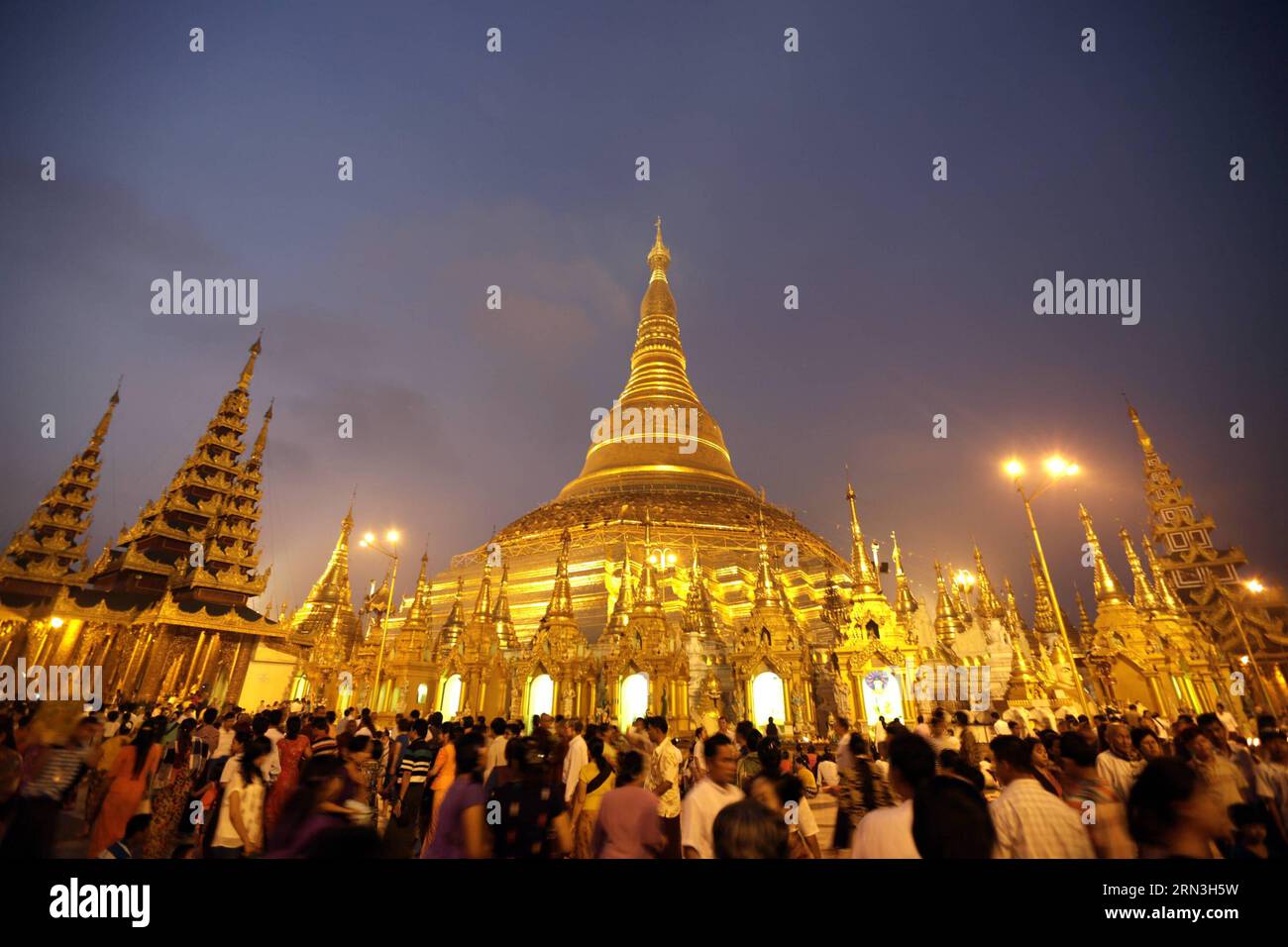 (150417) -- YANGON, April 17, 2015 -- People gather to pray on the first day of Myanmar s new year at the world-famous Shwedagon Pagoda in Yangon, Myanmar, April 17, 2015. On the first day of Myanmar s new year, people in the country used to perform meritorious deeds and Buddhists, who account for the majority of the people, usually go to the pagodas, monasteries and meditation centers where they practice meditation. ) MYANMAR-YANGON-NEW YEAR UxAung PUBLICATIONxNOTxINxCHN   Yangon April 17 2015 Celebrities gather to Pray ON The First Day of Myanmar S New Year AT The World Famous Shwedagon Pago Stock Photo