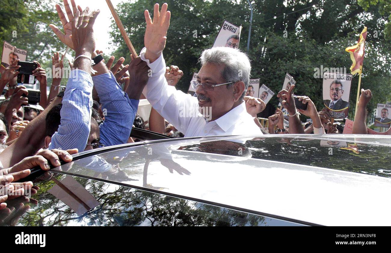 (150423) -- COLOMBO, April 23, 2015 -- Sri Lankan former Defense Secretary Gotabaya Rajapakse (C) greets his supporters as he arrived at the anti-graft commission office in Colombo, capital of Sri Lanka, on April 23, 2015. Sri Lankan former Defense Secretary Gotabaya Rajapakse arrived at the country s anti-graft commission on Thursday after he was summoned over corruption allegations. ) SRI LANKA-COLOMBO-FORMER DEFENSE SECRETARY-ANTI-GRAFT COMMISSION A.xRajhith PUBLICATIONxNOTxINxCHN   Colombo April 23 2015 Sri Lankan Former Defense Secretary Rajapaksa Rajapakse C greets His Supporters As he a Stock Photo