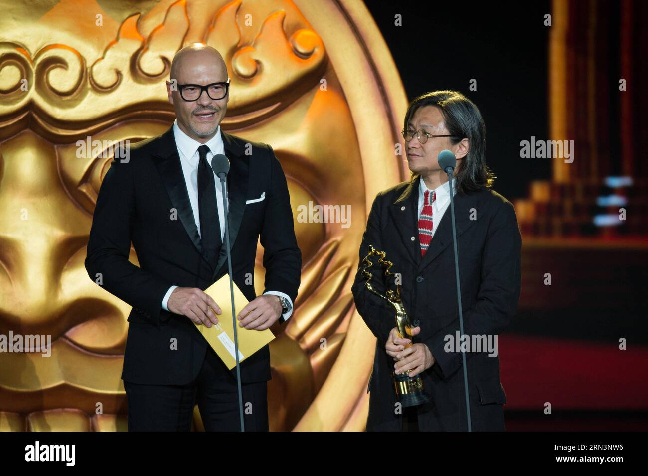 (150423) -- BEIJING, April 23, 2015 -- Guests Peter Chan (R) and Fedor Bondarchuk attend the awarding ceremony of the Tiantan Award of the fifth Beijing International Film Festival (BJIFF) in Beijing, capital of China, April 23, 2015. ) (mp) CHINA-BEIJING-FILM FESTIVAL-TIANTAN AWARD (CN) ChenxJianli PUBLICATIONxNOTxINxCHN   Beijing April 23 2015 Guests Peter Chan r and Fedor Bondarchuk attend The awarding Ceremony of The Tiantan Award of The Fifth Beijing International Film Festival  in Beijing Capital of China April 23 2015 MP China Beijing Film Festival Tiantan Award CN ChenxJianli PUBLICATI Stock Photo