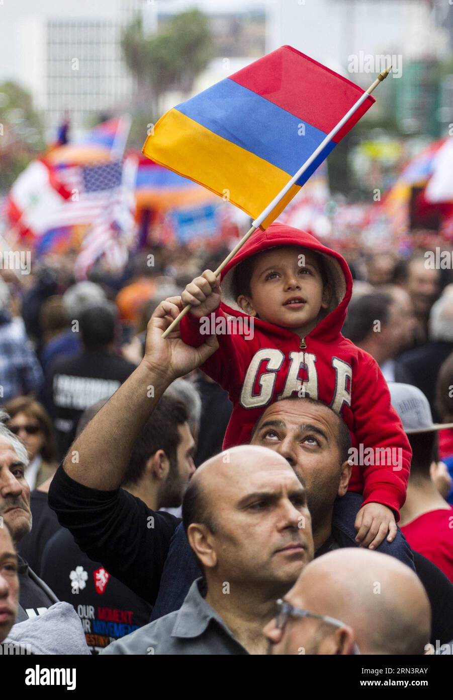 (150425) -- LOS ANGELES, Apr. 25, 2015 -- A child waves an Armenian national flag during the rally marking the 100th anniversary of a genocide against the Armenians, in Los Angeles, the United States, on April 25, 2015. Demonstrators holding placards and national flags of Armenia marched to the consulate of Turkey in Los Angeles to mark the 100th anniversary of a genocide against the Armenians. ) (zhf) US-LOS ANGELES-ARMENIA-GENOCIDE-100TH ANNIVERSARY-RALLY ZhaoxHanrong PUBLICATIONxNOTxINxCHN   Los Angeles Apr 25 2015 a Child Waves to Armenian National Flag during The Rally marking The 100th A Stock Photo