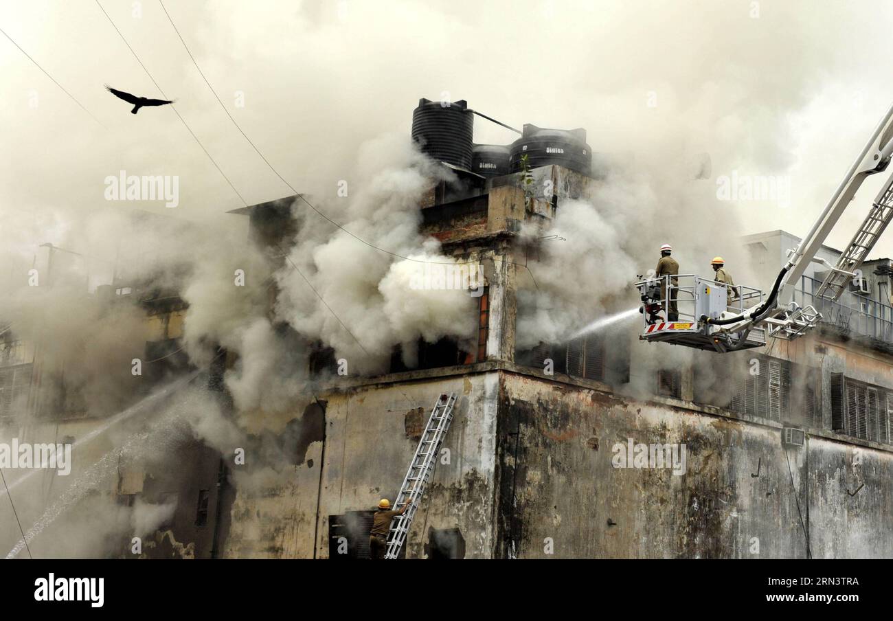 Indian fire fighters work at a fire site in Kolkata, capital of eastern Indian state West Bengal, April 26, 2015. A fire broke out at a shopping mall in central Kolkata on Sunday. According to fire brigade sources, 25 fire tenders were pressed into service to put out the blaze. No casualty was so far reported. ) INDIA-KOLKATA-FIRE Stringer PUBLICATIONxNOTxINxCHN   Indian Fire Fighters Work AT a Fire Site in Kolkata Capital of Eastern Indian State WEST Bengal April 26 2015 a Fire Broke out AT a Shopping Mall in Central Kolkata ON Sunday According to Fire Brigade Sources 25 Fire Tenders Were pre Stock Photo