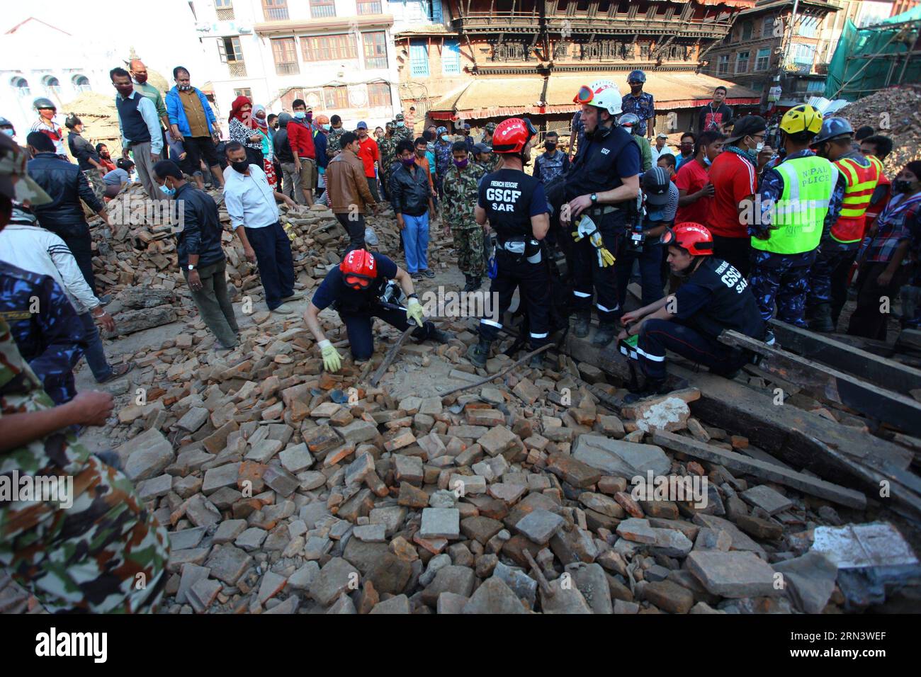 (150427) -- KATHMANDU, April 27, 2015 -- Rescuers search for victims on the bedris of a fallen temple at Hanuman Dhoka Durbar Square after the massive earthquake in Kathmandu, Nepal, April 27, 2015. Death toll climbed to 3,815 following a massive 7.9-magnitude earthquake in Nepal Saturday, while 7,046 sustained injuries, says the country s ministry of foreign affairs Monday. ) NEPAL-KATHMANDU-EARTHQUAKE-AFTERMATH SunilxSharma PUBLICATIONxNOTxINxCHN   Kathmandu April 27 2015 Rescue Search for Victims ON The  of a Fall Temple AT Hanuman Dhoka Durbar Square After The Massive Earthquake in Kathman Stock Photo