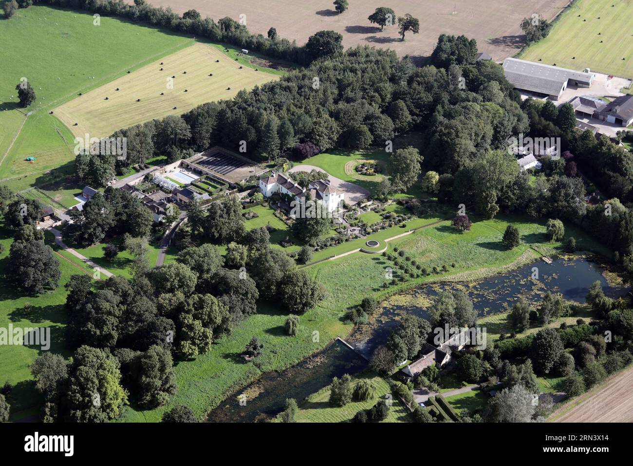 aerial view of a private house with lake (Firby Beck) at Firby, just south of Bedale, North Yorkshire Stock Photo