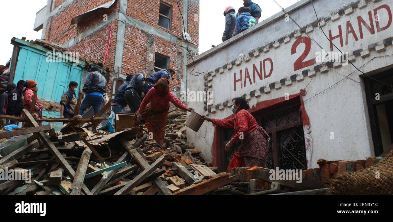 (150429) -- LALITPUR, April 29, 2015 -- People remove the debris after earthquake in Lalitpur, Nepal, April 29, 2015. The 7.9-magnitude quake hit Nepal at midday on Saturday. The death toll from the powerful earthquake has soared to 5,057 and a total of 10,915 others were injured. ) (djj) NEPAL-LALITPUR-EARTHQUAKE-AFTERMATH SunilxSharma PUBLICATIONxNOTxINxCHN   Lalitpur April 29 2015 Celebrities REMOVE The debris After Earthquake in Lalitpur Nepal April 29 2015 The 7 9 magnitude Quake Hit Nepal AT midday ON Saturday The Death toll from The Powerful Earthquake has soared to 5  and a total of 10 Stock Photo