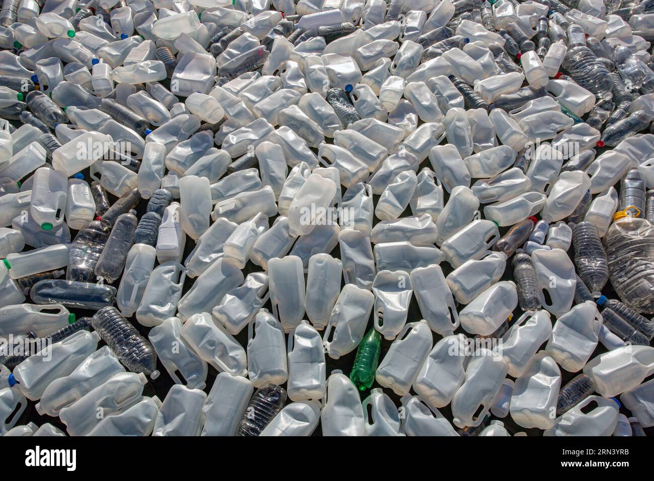 Plastic waste in floating on the surface of water pollution. Sea of plastic waste . Stock Photo