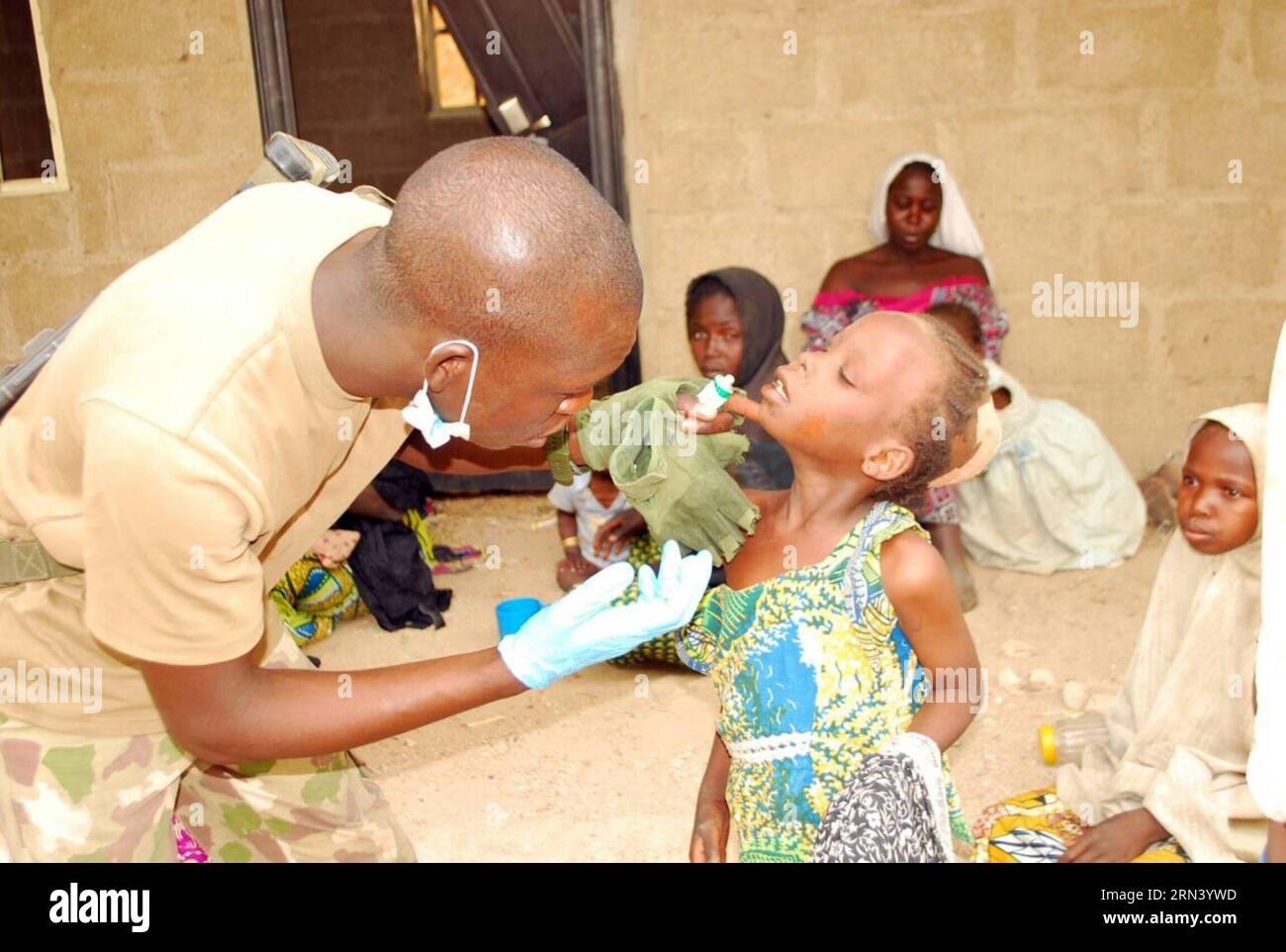 (150430) -- SAMBISA, April 30, 2015 -- One Nigerian military medic attends to a hostage child in Sambisa forest, North-Eastern Nigeria, April 30, 2015. Up to 300 unidentified females have been rescued by Nigerian troops in restive northeast Sambisa forest following a daring and precise operation, a military spokesperson said on Tuesday. ) NIGERIA-SAMBISA-HOSTAGES-RESCUE Dare PUBLICATIONxNOTxINxCHN   April 30 2015 One Nigerian Military Medic Attends to a Hostage Child in  Forest North Eastern Nigeria April 30 2015 up to 300 unidentified females have been Rescued by Nigerian Troops in restive No Stock Photo