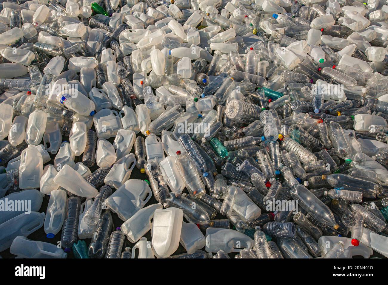 Plastic waste in floating on the surface of water pollution. Sea of plastic waste . Stock Photo