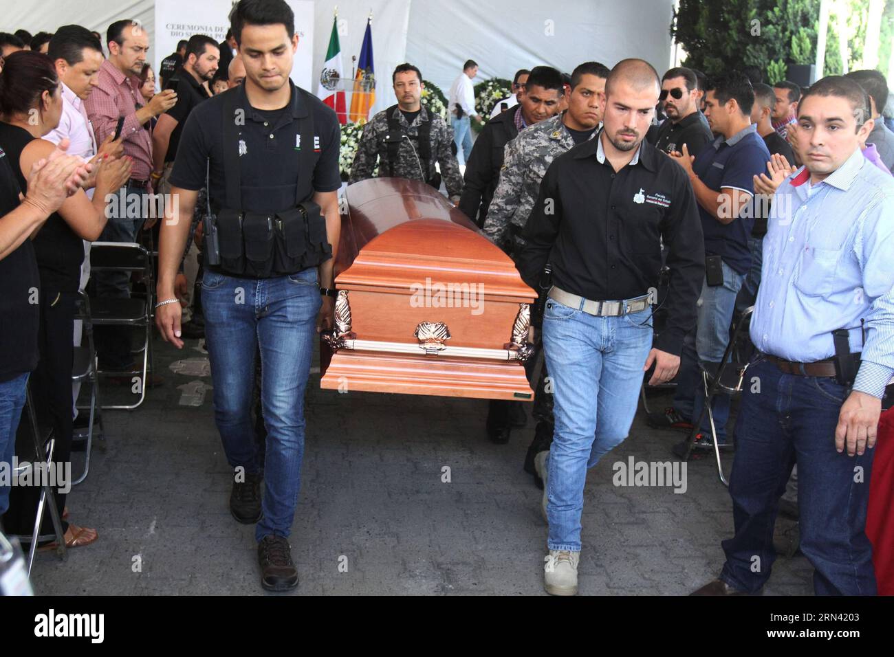 People carry the coffin of Mario Alberto Jorge Olivares Castorena, a policeman that died in the violent acts on Friday, during his funeral in Guadalajara, Jalisco state, Mexico, on May 2, 2015. According to local press, At least seven people were killed and 19 others injured during an outbreak of violence early Friday in parts of Mexico s western state of Jalisco, where local government launched an operation against a drug cartel. Str) (da) MEXICO-JALISCO-SECURITY-VIOLENCE e STR PUBLICATIONxNOTxINxCHN   Celebrities Carry The Coffin of Mario Alberto Jorge Olivares  a Policeman Thatcher died in Stock Photo