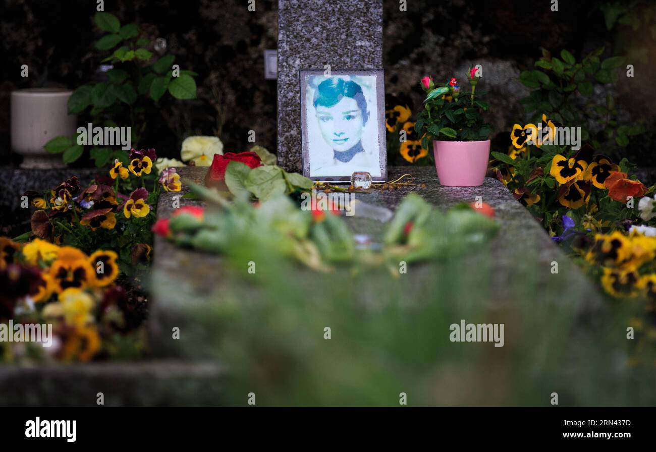 (150504) -- GENEVA, May 4, 2015 -- Flowers are placed at the grave of actress Audrey Hepburn in Tolochenaz village in Switzerland, May 4, 2015. Audrey Hepburn, born in Brussels, Belgium, May 4, 1929, was recognized as a film and fashion icon during Hollywood s Golden Age, and also regarded by the American Film Institute as one of the greatest female screen legends in the history of American cinema. ) SWITZERLAND-MORGES-AUDREY HEPBURN-ANNIVERSARY XuxJinquan PUBLICATIONxNOTxINxCHN Stock Photo