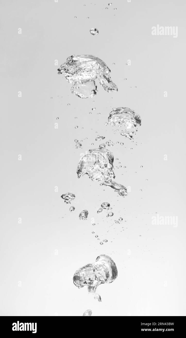 Air bubbles in water on white background Stock Photo