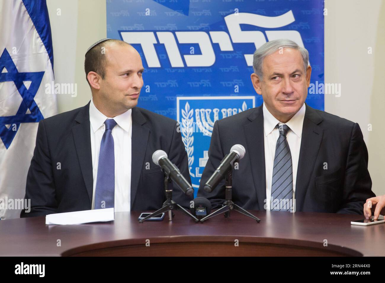 (150507) -- JERUSALEM, May 6, 2015 -- Israeli Prime Minister Benjamin Netanyahu (R) and Jewish Home party leader Naftali Bennett hold a press conference in Jerusalem May 6, 2015. Benjamin Netanyahu managed to clinch a deal with the nationalist Jewish Home party late Wednesday night, securing a new ruling coalition with a tiny majority in the 120-member parliament. ) ISRAEL-NEW COALITION-PRESS CONFERENCE JINI PUBLICATIONxNOTxINxCHN   Jerusalem May 6 2015 Israeli Prime Ministers Benjamin Netanyahu r and Jewish Home Party Leader Naftali Bennett Hold a Press Conference in Jerusalem May 6 2015 Benj Stock Photo