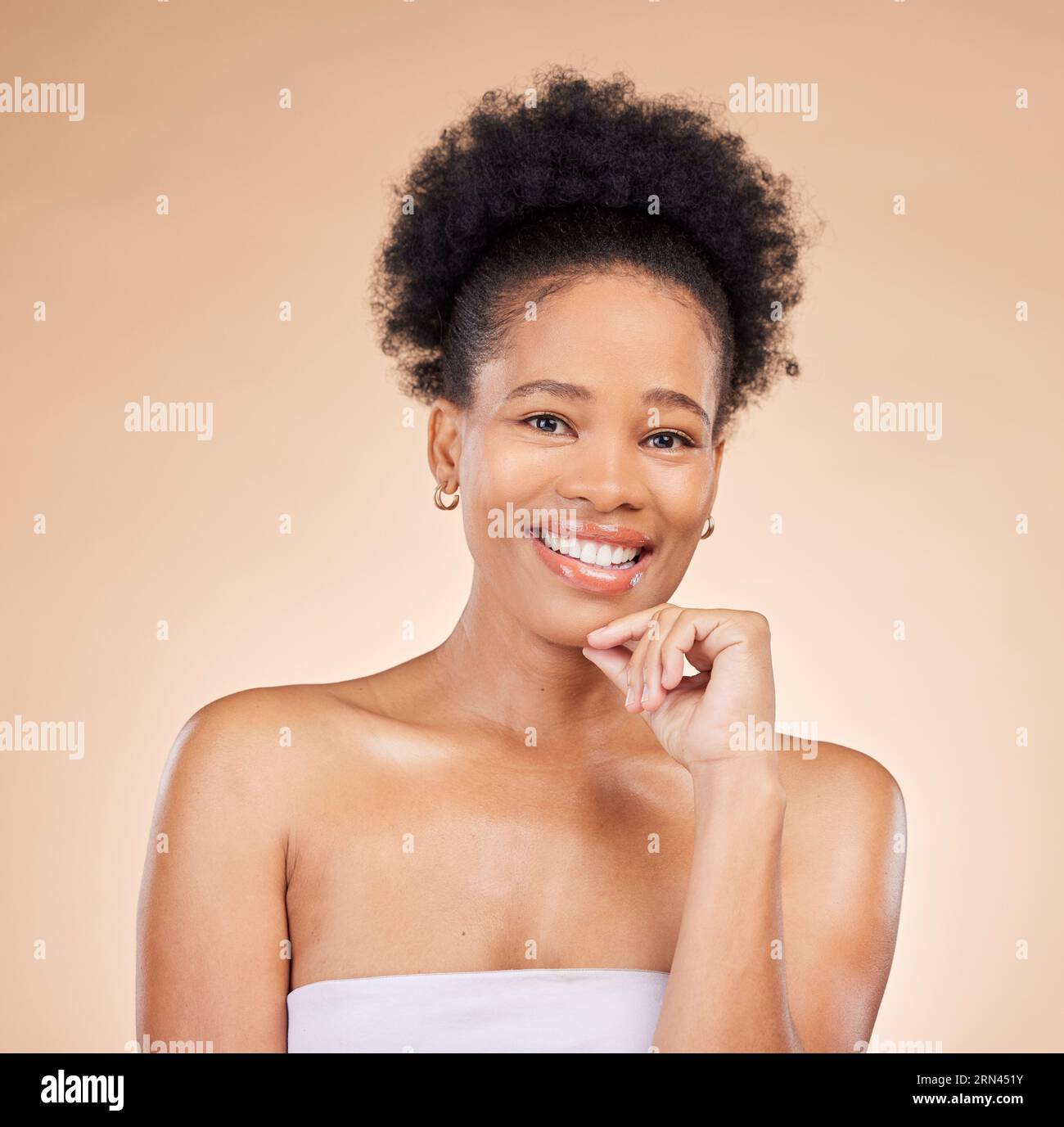Face, skincare and beauty of black woman, happy and isolated on a brown background in studio