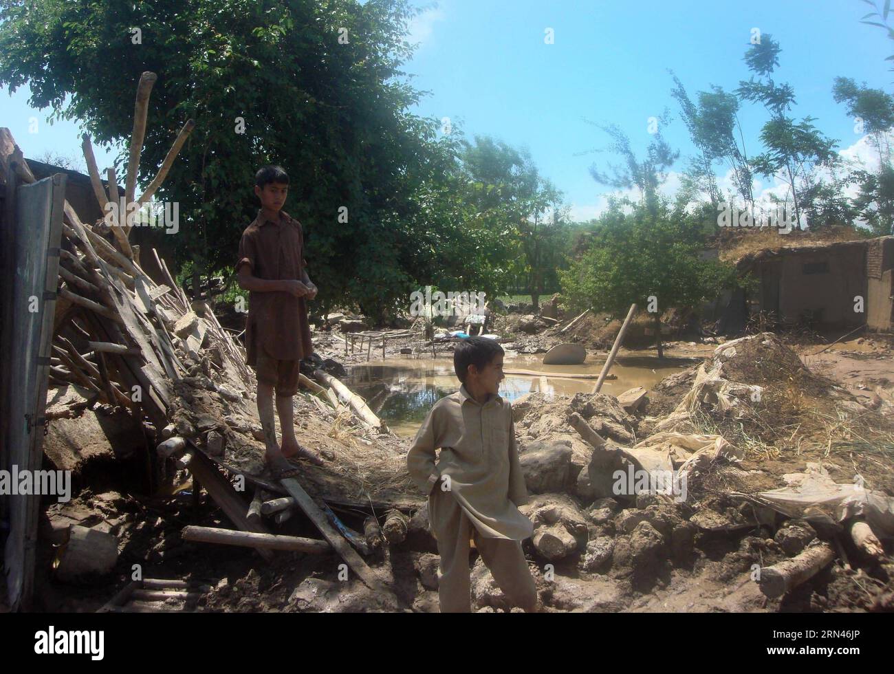 (150509) -- BAGHLAN, May 9, 2015 -- Afghan children gather around their destroyed houses after a heavy rain in Baghlan province, north Afghanistan, on May 9, 2015. One person has been confirmed dead and 10 others injured as flood washed away more than 500 houses in Baghlan-e-Markazi district of the northern Baghlan province early Saturday, district governor Gohar Khan Babri said. )(zhf) AFGHANISTAN-BAGHLAN-FLOOD Sahil PUBLICATIONxNOTxINxCHN   Baghlan May 9 2015 Afghan Children gather Around their destroyed Houses After a Heavy Rain in Baghlan Province North Afghanistan ON May 9 2015 One Person Stock Photo