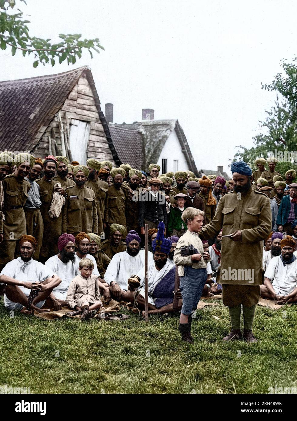 Sikhs & French villagers [Le Sart, France]. Date: 24 Jul 1915 Stock Photo