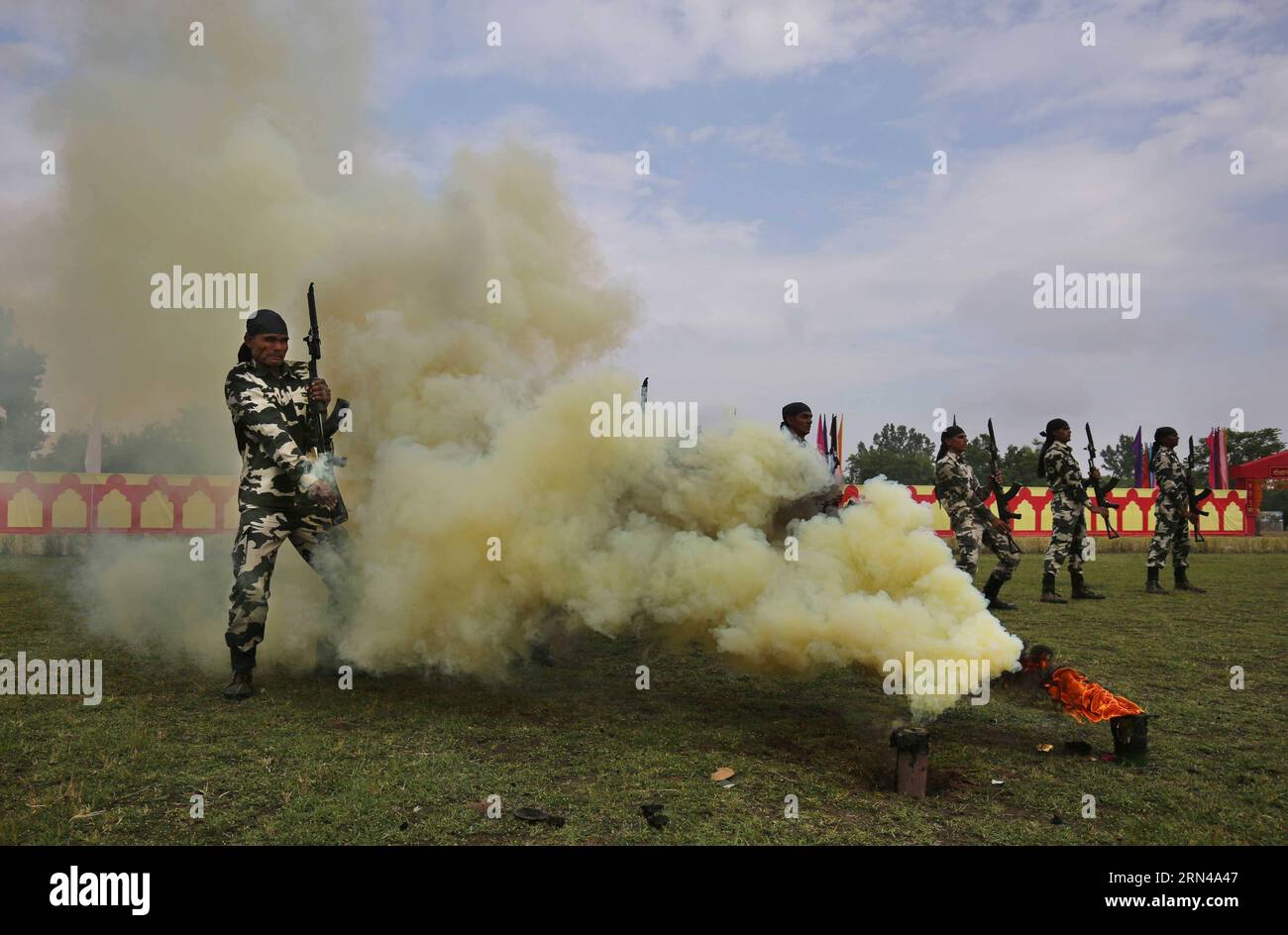 (150514) -- SRINAGAR, May 14, 2015 -- Recruits of India s Central Reserve Police Force (CRPF) show their skills during a passing-out parade at a training center on the outskirts of Srinagar, the summer capital of Indian-controlled Kashmir, May 14, 2015. A total of 341 recruits were formally inducted into the India s CRPF after completing nine months of rigorous training in physical fitness, weapon handling, commando operations and counter insurgency, a CRPF spokesman said. ) (azp) KASHMIR-SRINAGAR-PASSING-OUT PARADE JavedxDar PUBLICATIONxNOTxINxCHN   150514 Srinagar May 14 2015 recruits of Ind Stock Photo