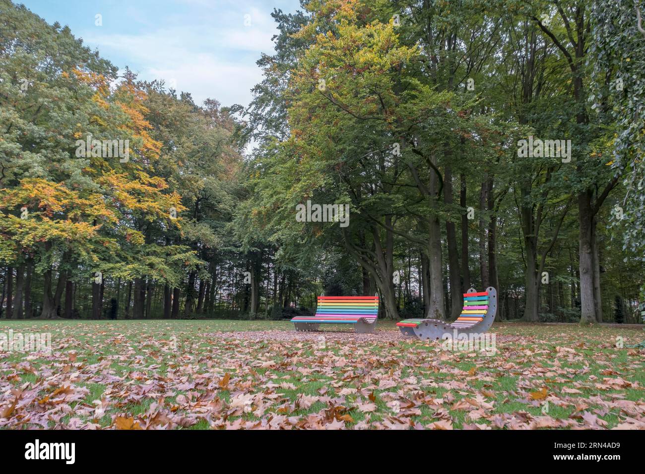 Colourful bench and colourful lounger, palace gardens Ahaus, Muensterland, North Rhine-Westphalia, Deuts Stock Photo