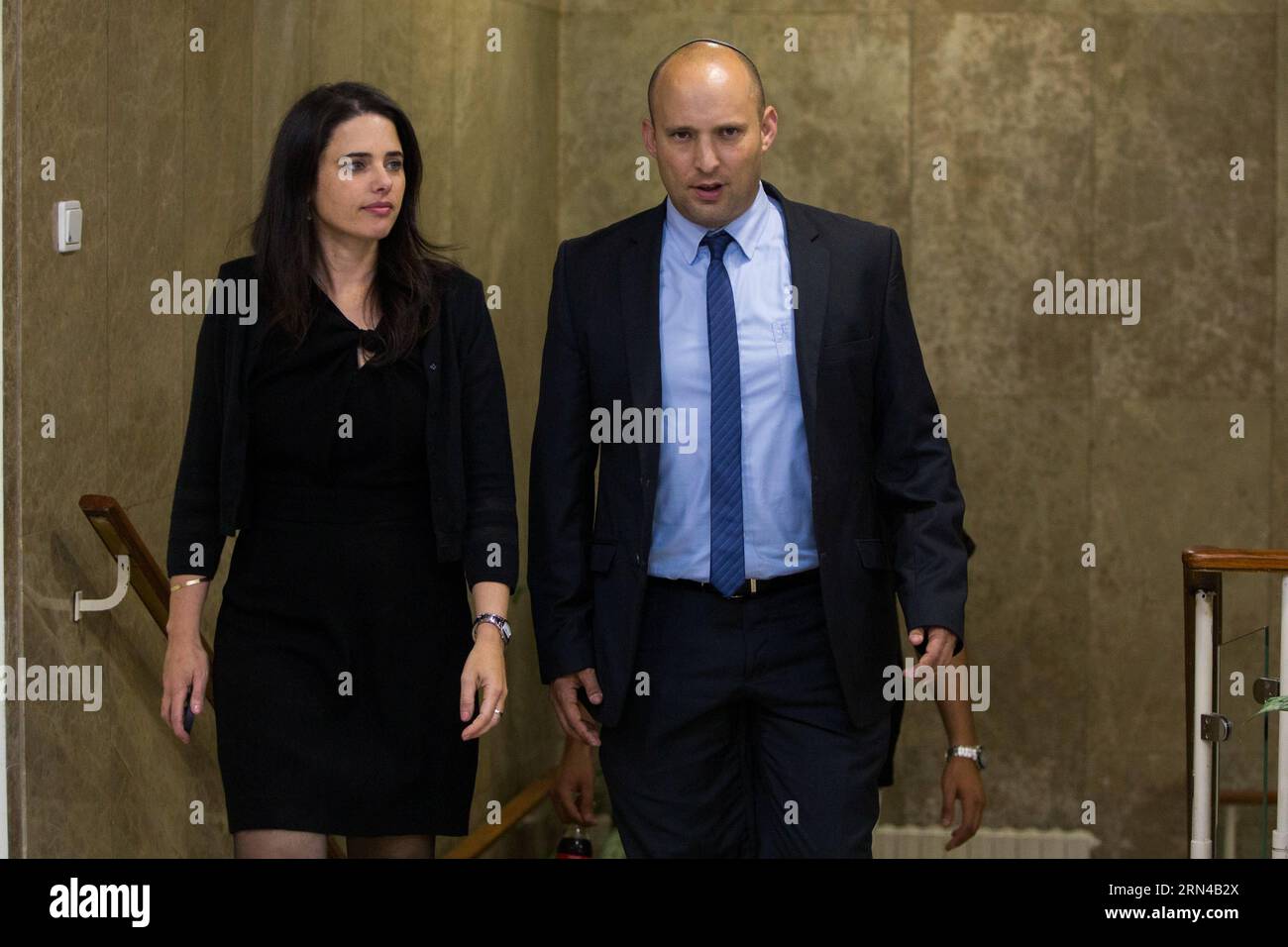 (150515) -- JERUSALEM, May 15, 2015 -- Incoming Israeli Justice Minister Ayelet Shaked (L) and incoming Israeli Education Minister Naftali Bennett arrive for the first cabinet meeting of the Israel s 34th government at the Prime Minister s office in Jerusalem, on May 15, 2015. Israeli Prime Minister Benjamin Netanyahu s right-wing new coalition government was sworn in late Thursday night, after the parliament approved it by a razor-thin 61-59 majority. /Yonatan Sindel) MIDEAST-JERUSALEM-ISRAEL-34TH GOV T-FIRST CABINET MEETING JINI PUBLICATIONxNOTxINxCHN   Jerusalem May 15 2015 Incoming Israeli Stock Photo