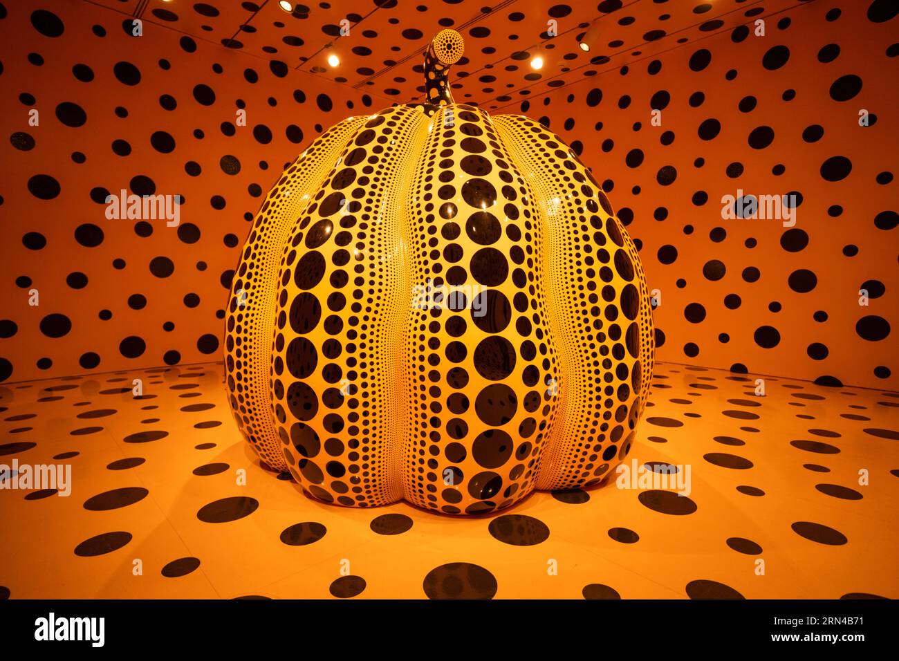 WASHINGTON DC — Pumpkin (2016). It's part of an exhibition titled One with Eternity, by Yayoi Kusama, on display at the Smithsonian Hirshhorn Museum in Washington DC. One with Eternity showcases the Hirshhorn’s permanent collection of works by Kusama, including two of her Infinity Mirror Rooms—her first and one of her most recent—that create a dazzling sensation of never-ending space. These transcendent rooms will be exhibited alongside an early painting; sculptures, including Pumpkin (2016) and Flowers—Overcoat (1964); and photographs of the artist. This exhibition honors Kusama’s distinctive Stock Photo
