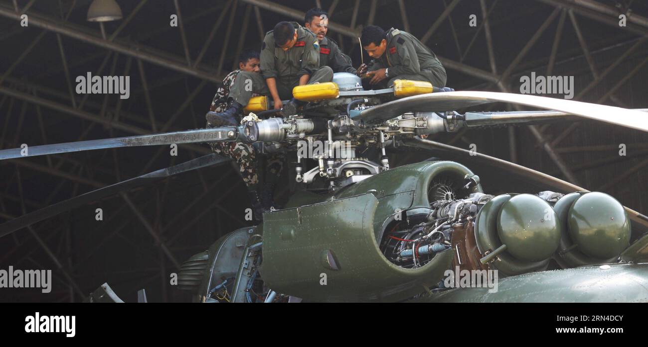Nepalese Army personnel make a regular maintenance for an army chopper in Kathmandu, Nepal, May 17, 2015. Three bodies had been recovered near the wreckage of a missing U.S. military chopper, an official from the Nepal government confirmed Friday. The U.S. military chopper, which was on a rescue mission in the worst quake-hit areas of Dolakha, lost contact on May 12. There were eight people on board the military chopper including two Nepalese soldiers and six U.S. marines. ) NEPAL-KATHMANDU-U.S. CHOPPER-ACCIDENT SunilxSharma PUBLICATIONxNOTxINxCHN   Nepalese Army Personnel Make a Regular Maint Stock Photo