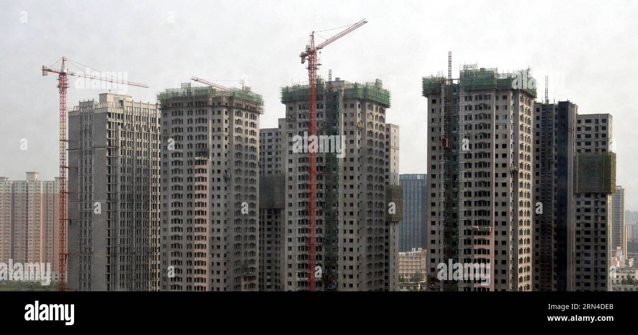 Photo taken on May 16, 2015 shows commercial residential buildings under construction in the Jinshui District of Zhengzhou, capital of central China s Henan Province. China s real estate market remained anemic with new home prices in April registering month-on-month declines in 48 of the 70 surveyed cities. ) (wf) CHINA-APRIL-REAL ESTATE MARKET (CN) LixBo PUBLICATIONxNOTxINxCHN   Photo Taken ON May 16 2015 Shows Commercial Residential Buildings Under Construction in The  District of Zhengzhou Capital of Central China S Henan Province China S Real Estate Market remained anemic With New Home Pri Stock Photo