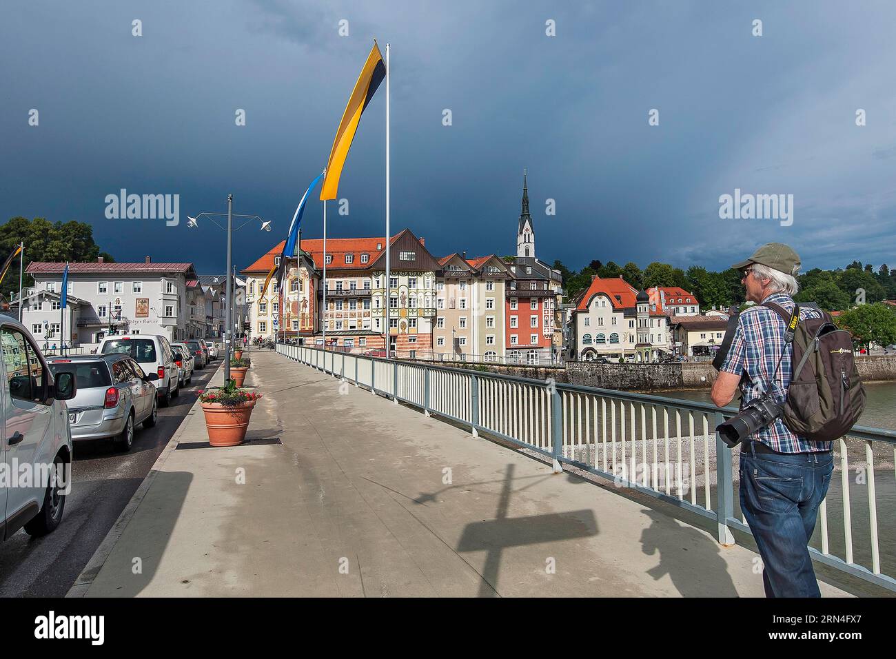 Flag-decorated bridge over the Isar with Gewiierhimmel, Bad Toelz, Upper Bavaria, Bavaria, Germany Stock Photo