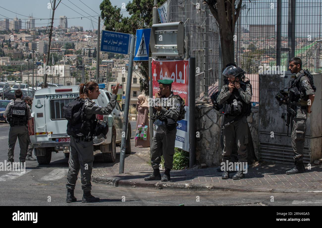 (150520) -- JERUSALEM, May 20, 2015 -- Israeli Border Police stand guard near the At-Tur Junction, east of the Mount of Olives in the Arab East Jerusalem, on May 20, 2015. Two Israeli Border Police officers were injured Wednesday morning after a Palestinian rammed his car into them in East Jerusalem, in a suspected run-over attack, police said. ) MIDEAST-JERUSALEM-PALESTINIAN CAR ATTACK LixRui PUBLICATIONxNOTxINxCHN   150520 Jerusalem May 20 2015 Israeli Border Police stand Guard Near The AT TUR Junction East of The Mount of Olives in The Arab East Jerusalem ON May 20 2015 Two Israeli Border P Stock Photo