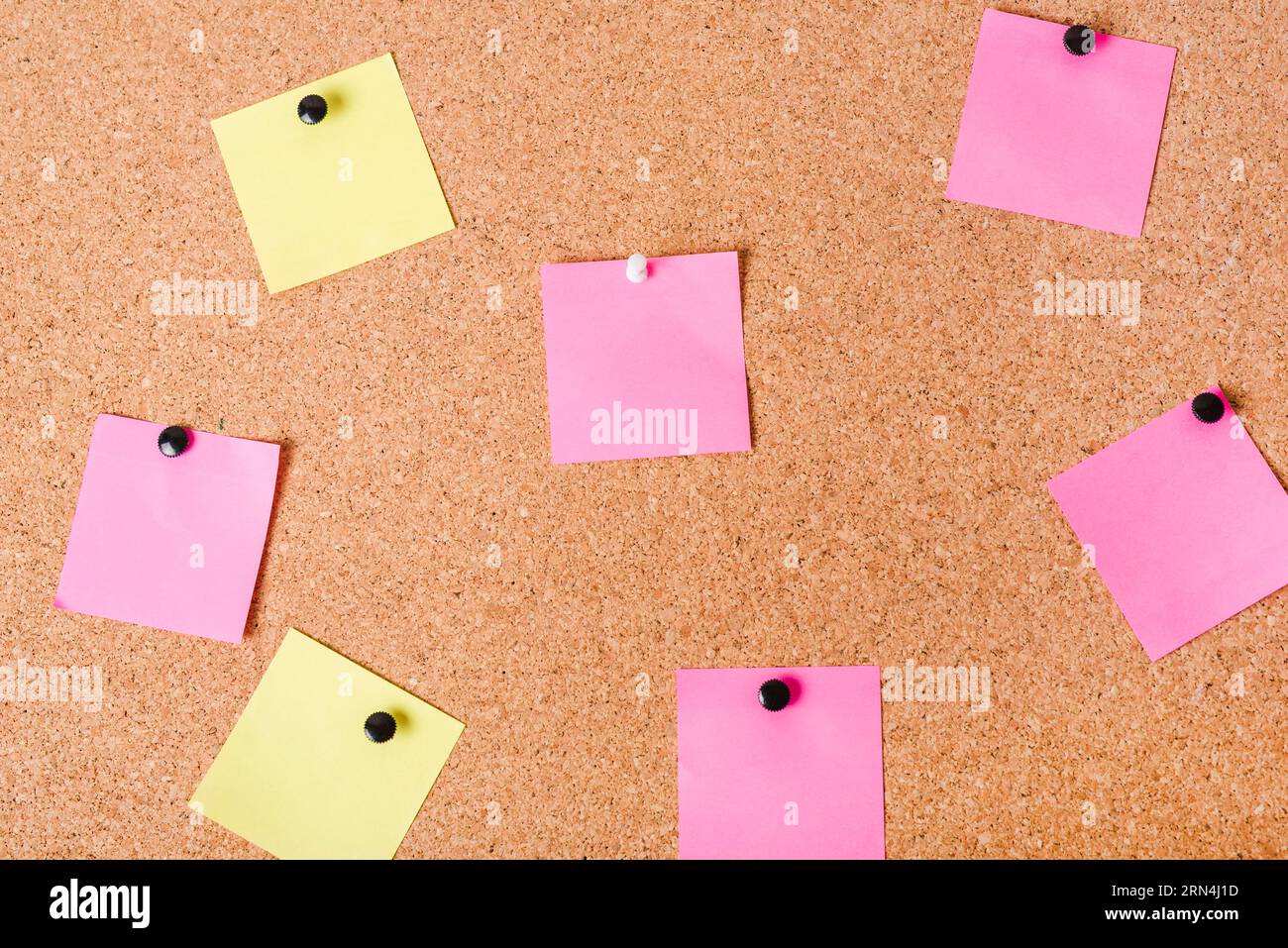 Close up corkboard with various note papers Stock Photo