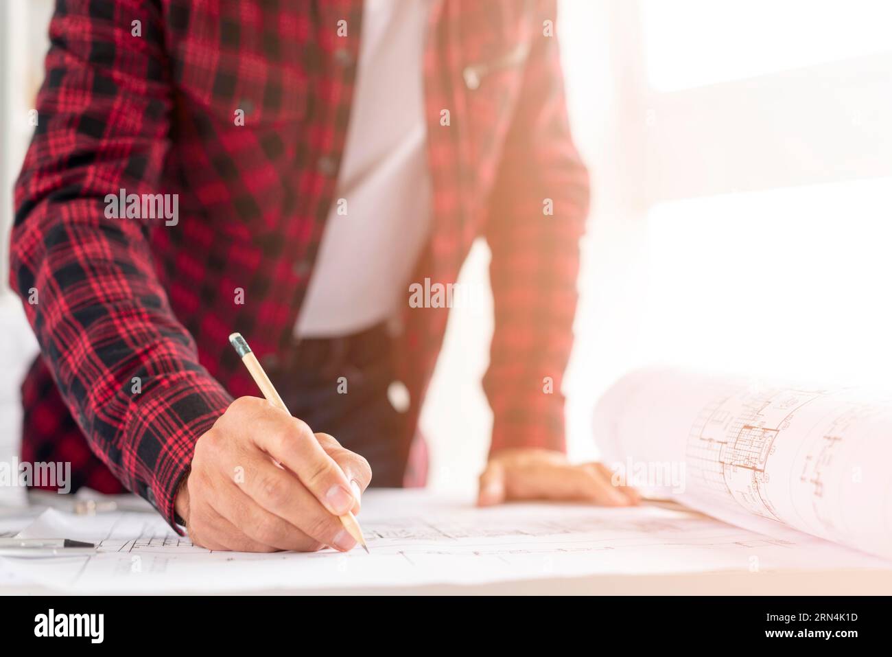 Medium shot man drawing architectural project Stock Photo