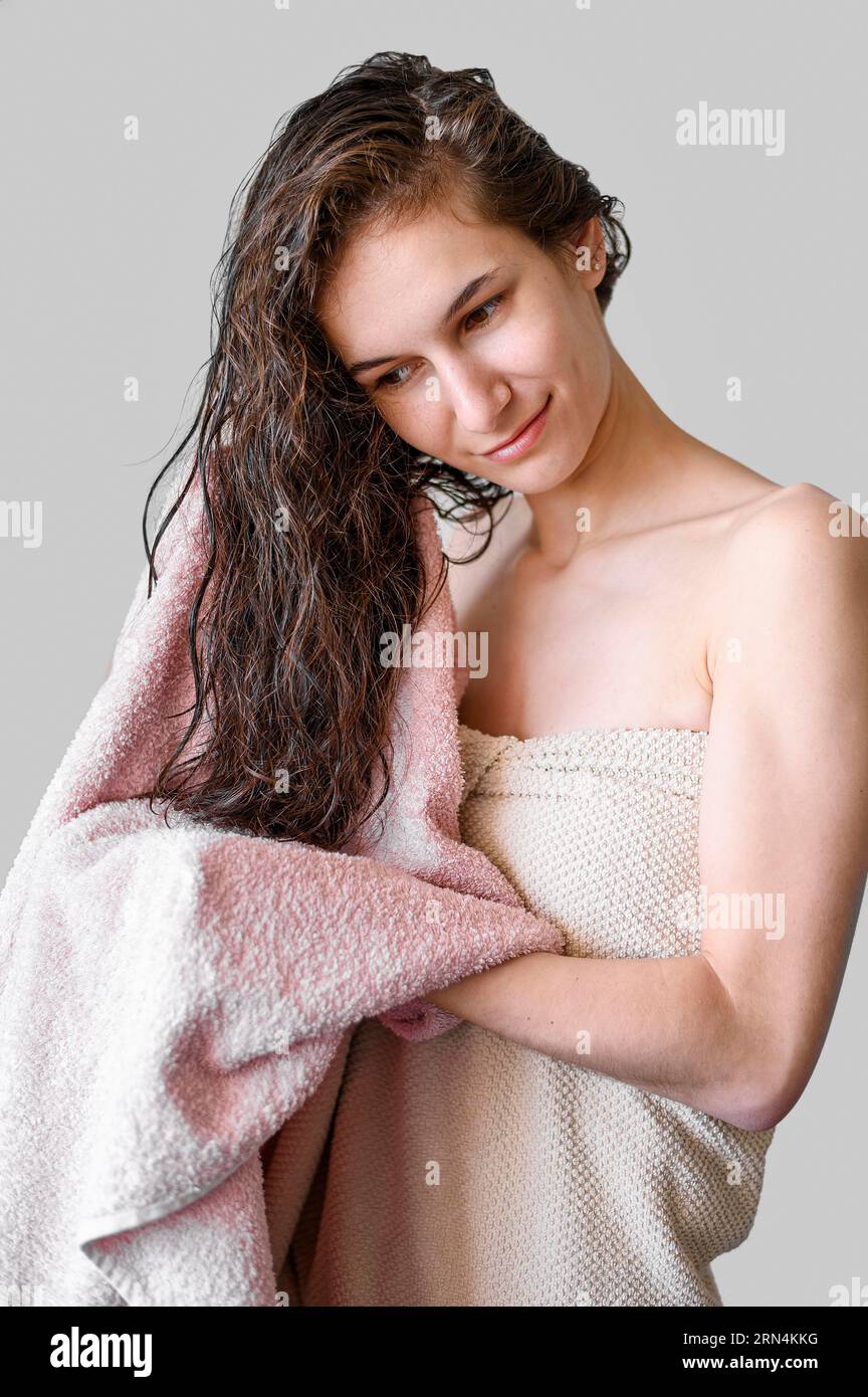 Portrait woman drying hair with towel Stock Photo Alamy