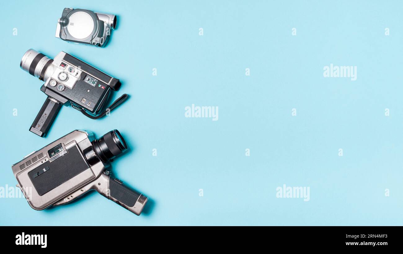 Various type camcorder blue background Stock Photo Alamy