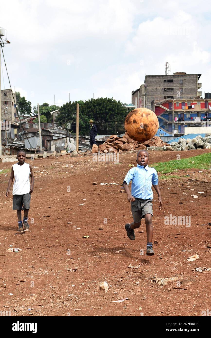 (150528) -- NAIROBI, May 28, 2015 -- School kids play football on a ground near Mcedo Beijing School at a slum area in Nairobi, Kenya, May 28, 2015. ) KENYA-NAIROBI-SLUM-DAILY LIFE-CHILDREN SunxRuibo PUBLICATIONxNOTxINxCHN   150528 Nairobi May 28 2015 School Kids Play Football ON a Ground Near MCEDO Beijing School AT a Slum Area in Nairobi Kenya May 28 2015 Kenya Nairobi Slum Daily Life Children SunxRuibo PUBLICATIONxNOTxINxCHN Stock Photo