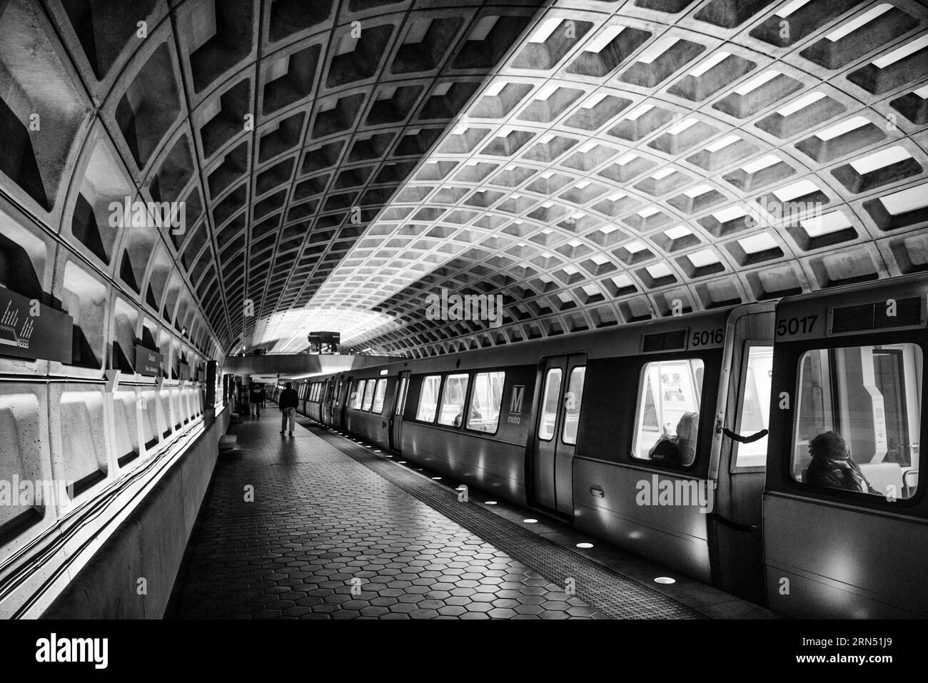 WASHINGTON DC, United States — A black and white photography of a Washington DC Metro station, representing one of the key transportation hubs that serve the nation's capital. The Metro system plays an essential role in the daily transit of thousands, connecting neighborhoods, business districts, and points of interest. Stock Photo